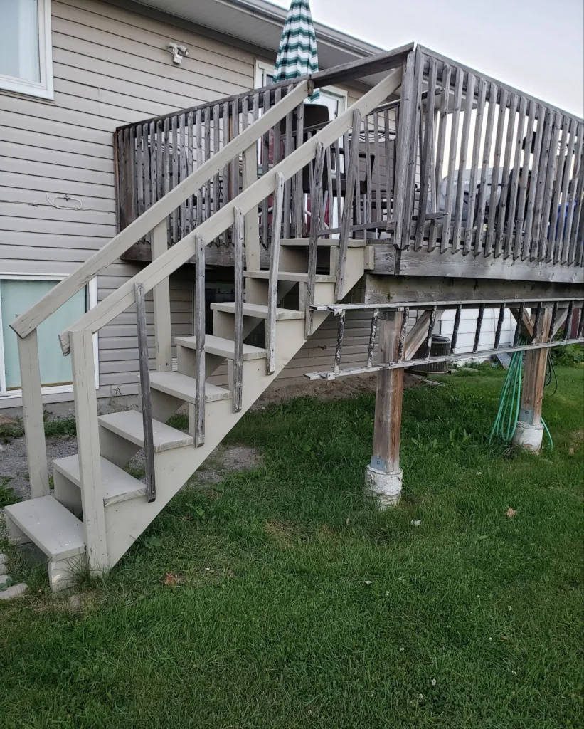 Weathered deck stairs before rebuilding
