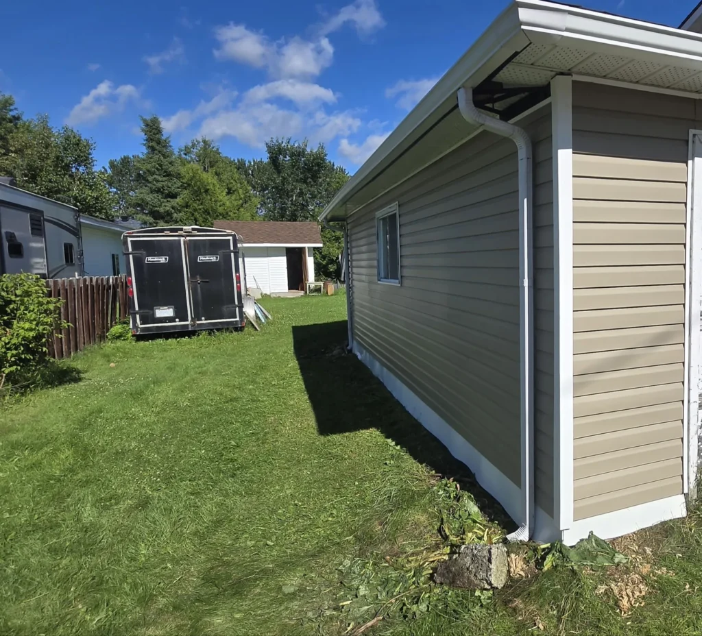 Completed vinyl siding and roofline finishing
