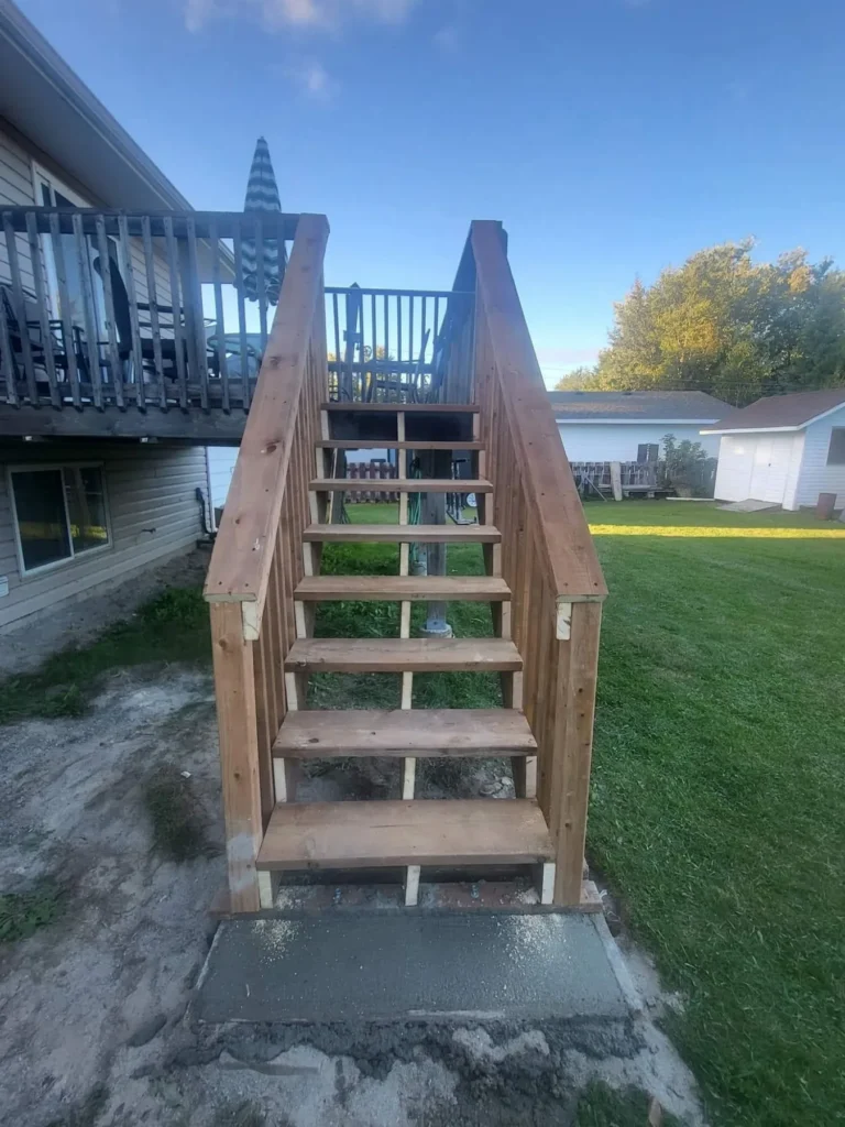 Completed wood deck stair and railing work